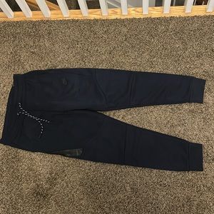 navy blue nike tech pants